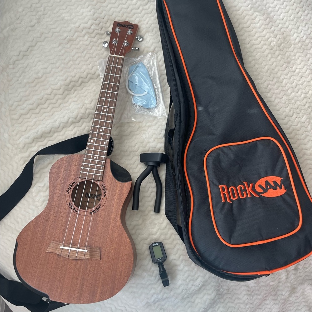 Ukelele w/ tuner, case, & extra strings